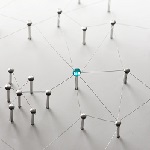 Linking entities. Network, networking, social media, connectivity, internet communication abstract. Web of thin silver wires on white background. Key Person or network hub.