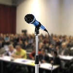 image of microphone during seminar in a hall